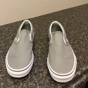 Gray and white slip on vans